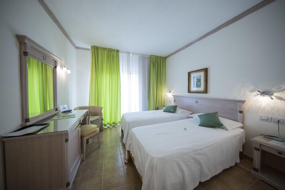 Foto de una habitación de Mancini Park Hotel