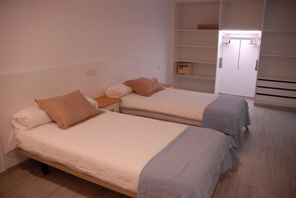 Foto de una habitación de Hotel Neptuno Suites