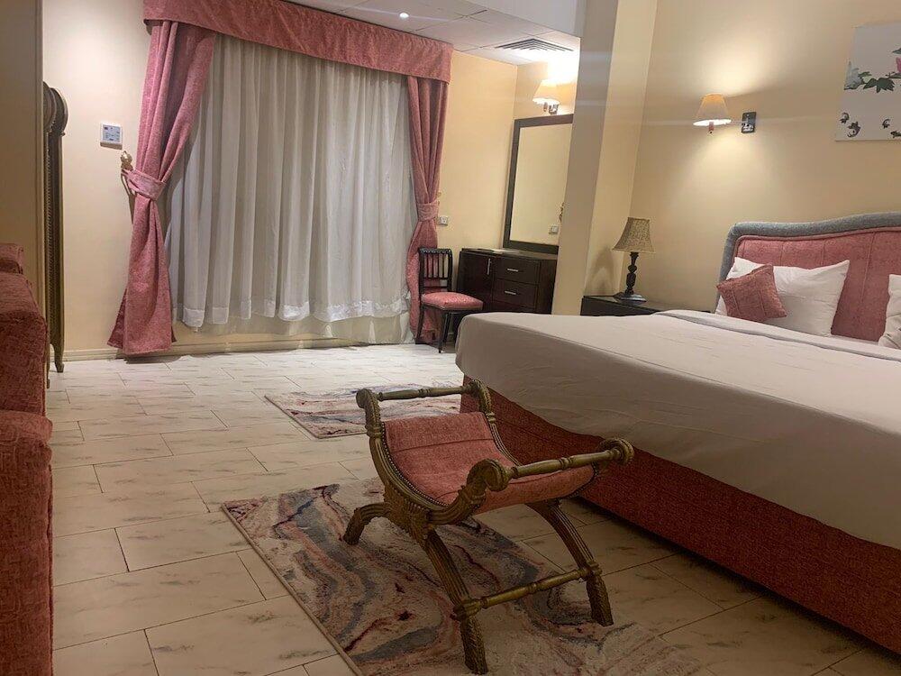 Foto de una habitación de Holidays Express Hotel