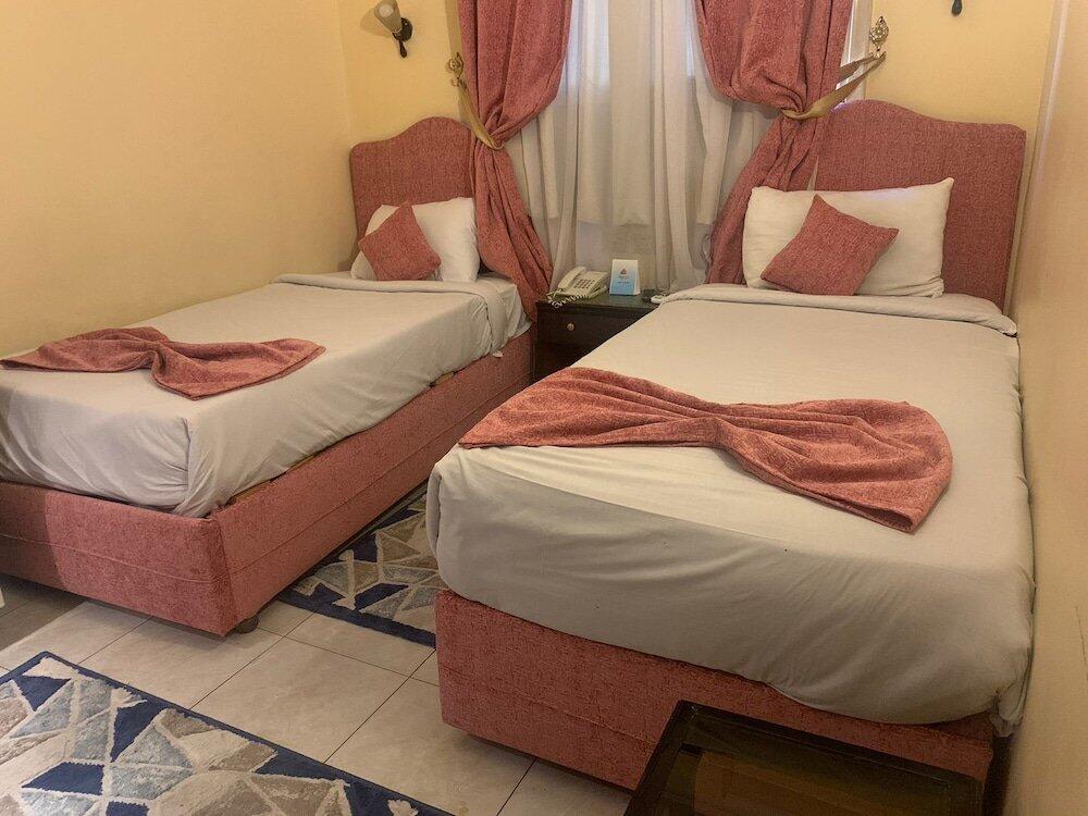 Foto de una habitación de Holidays Express Hotel