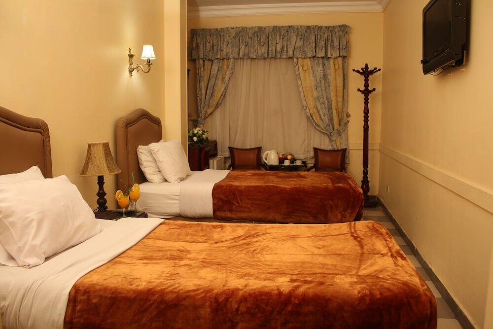 Foto de una habitación de Holidays Express Hotel
