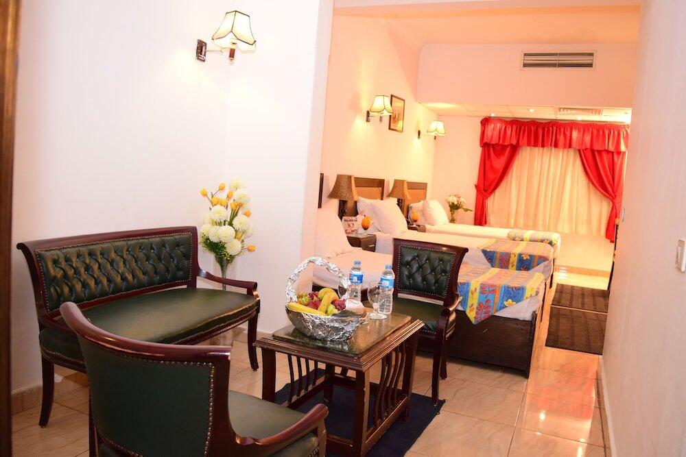 Foto de una habitación de Holidays Express Hotel