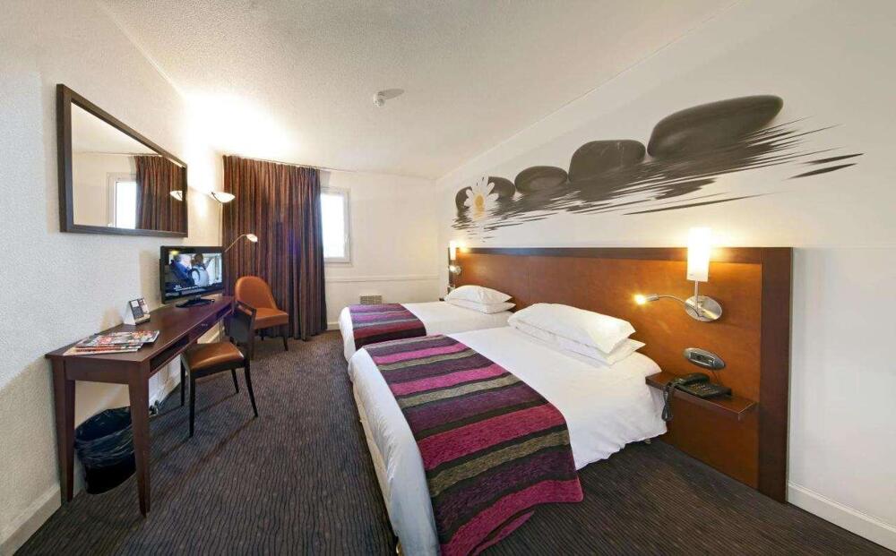 Foto de una habitación de Hotel du Golf Rosny