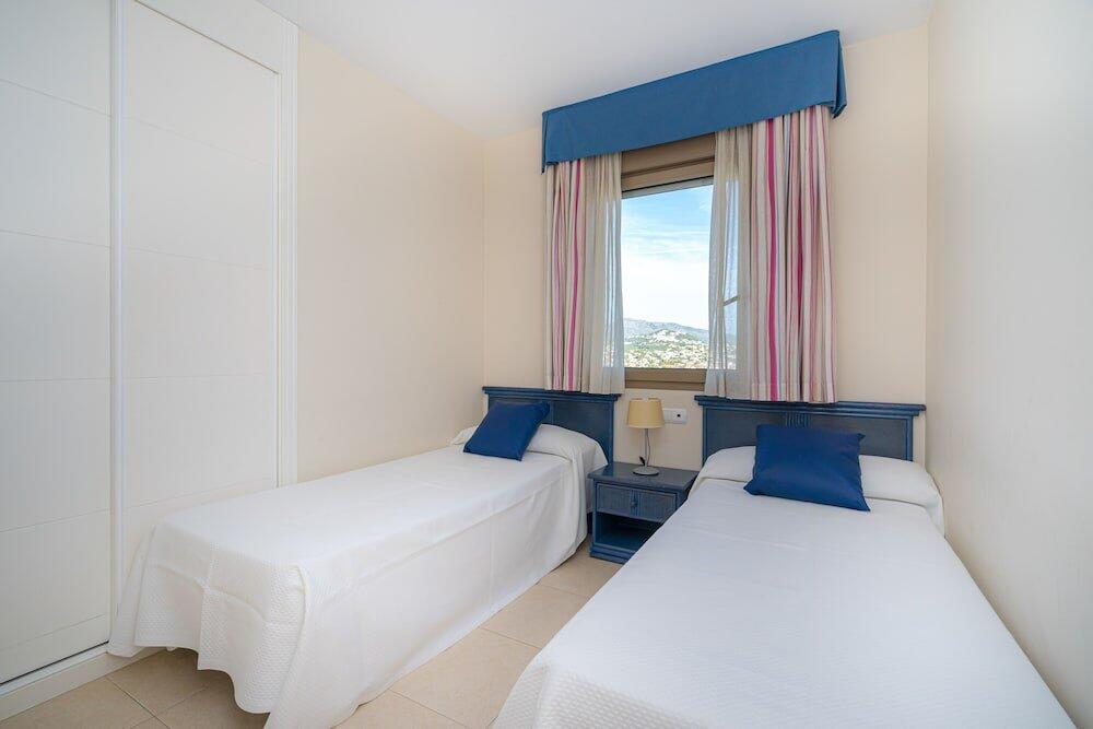 Foto de una habitación de Apartamentos Larimar Unitursa