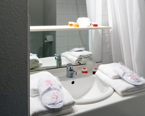 Foto del baño de Aparthotel Séjours &amp;amp; Affaires Caen Le Clos Beaumois