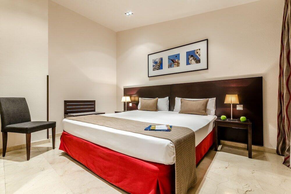 Foto de una habitación de Hotel Exe Suites 33