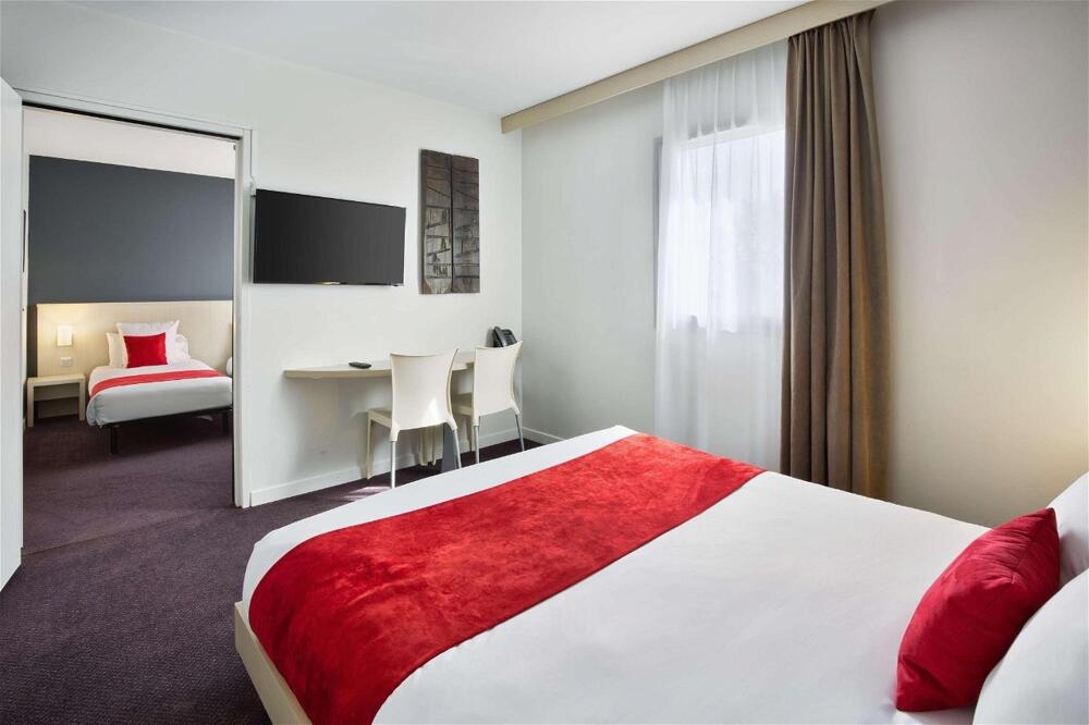 Foto de una habitación de Sure Hotel by Best Western Nantes Beaujoire