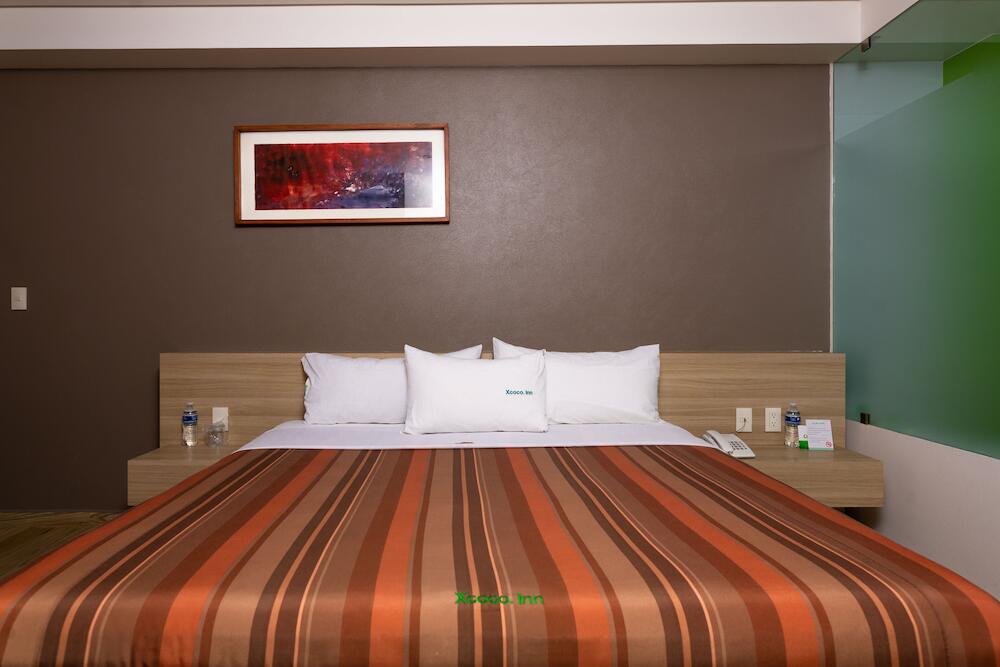 Foto de una habitación de Hotel Xcoco Inn