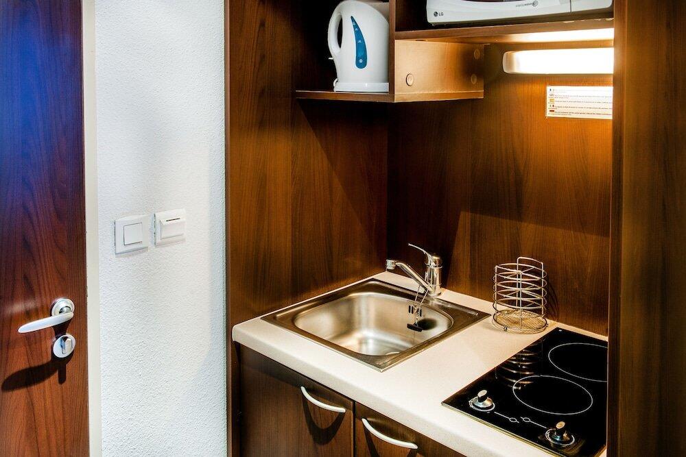 Foto de una habitación de Appart&amp;#039;hôtel Saint Jean