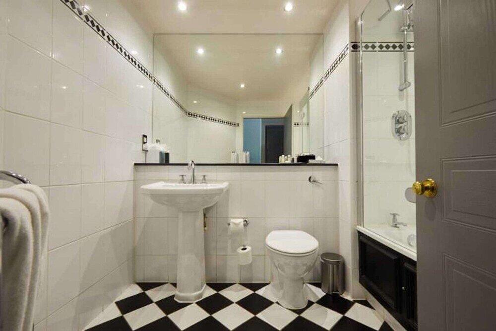 Foto del baño de Woughton House Hotel