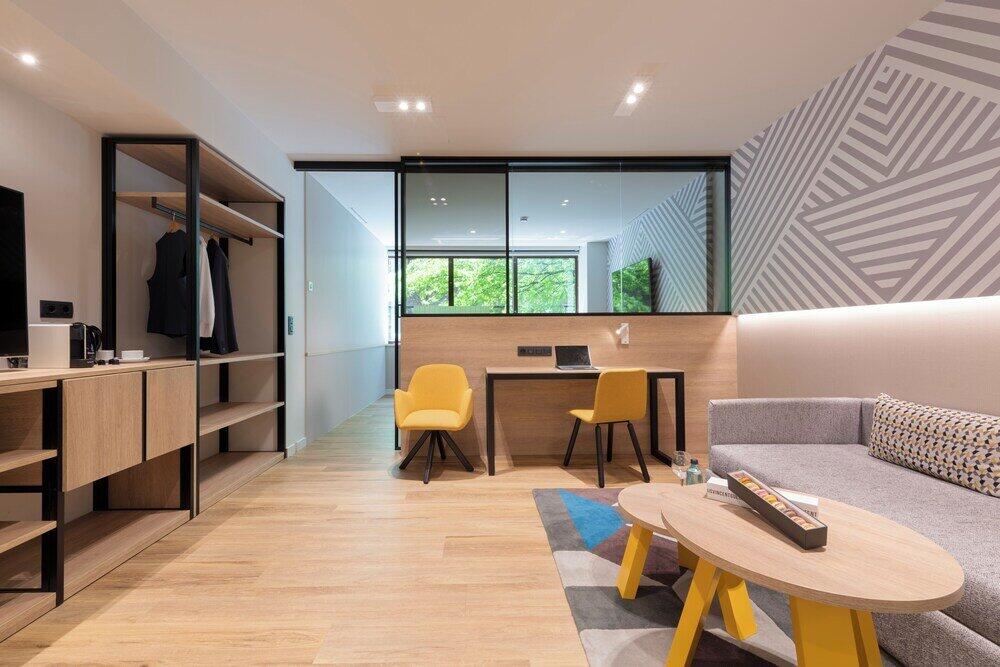 Foto de una habitación de Suites Plaza Hotel &amp;amp; Wellness