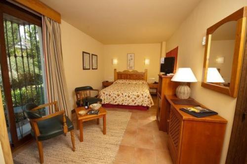 Foto de una habitación de Hotel Alcadima