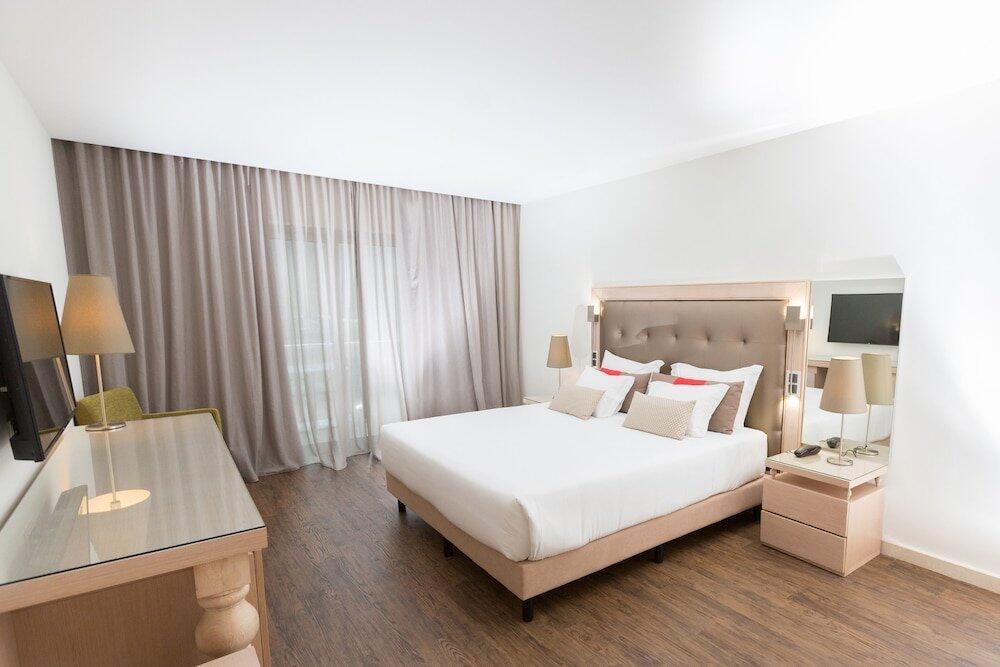 Foto de una habitación de Hotel Porta do Sol Conference &amp;amp; SPA