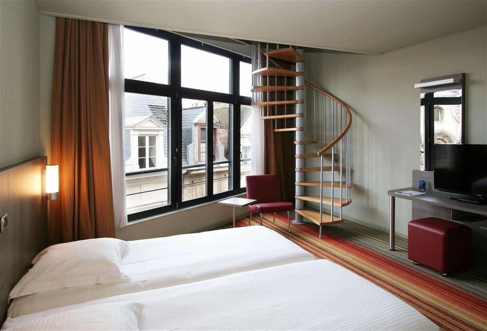 Foto de una habitación de Alma Grand Place Hotel