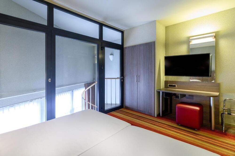Foto de una habitación de Alma Grand Place Hotel