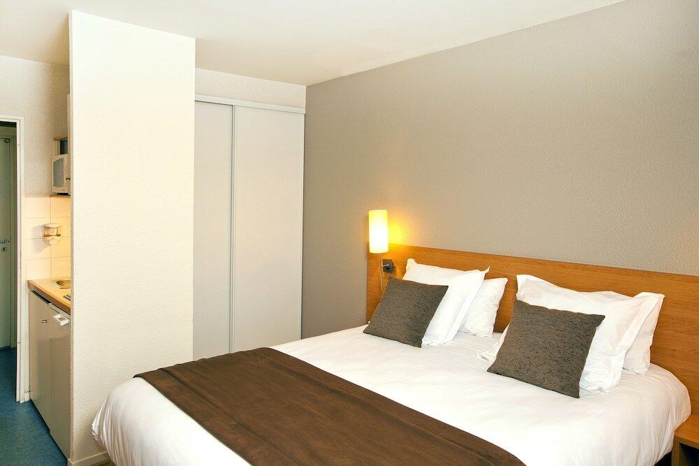 Foto de una habitación de Aparthotel Séjours &amp;amp; Affaires Rennes de Bretagne