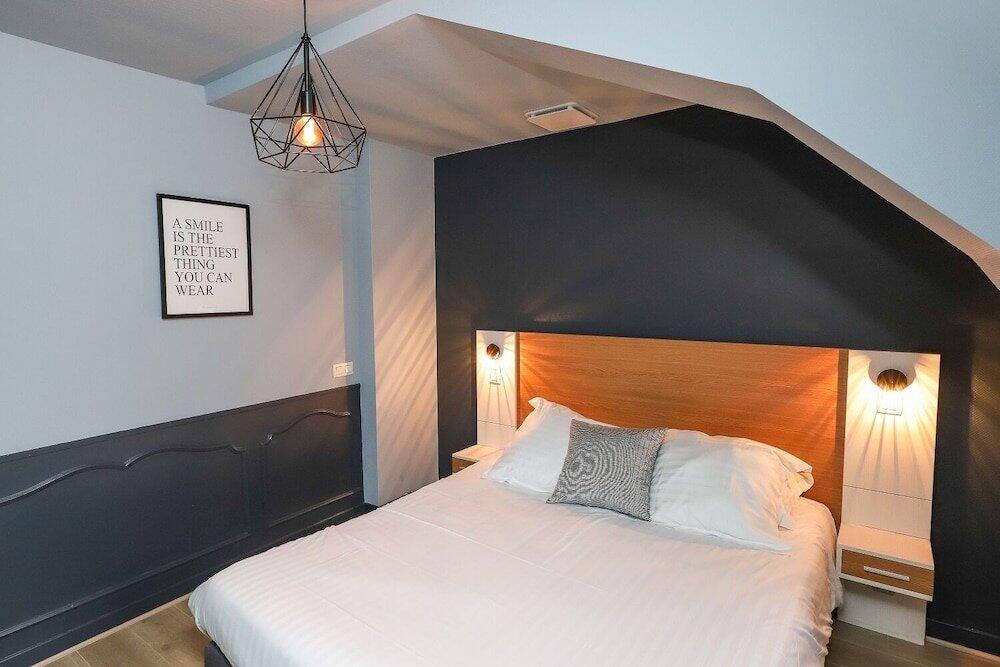 Foto de una habitación de Hôtel La Réserve de Brive