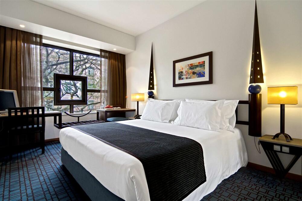 Foto de una habitación de SANA Executive Hotel