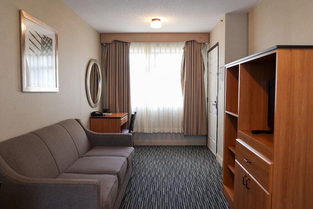 Foto de una habitación de Hotel City Center Inn &amp;amp; Suites