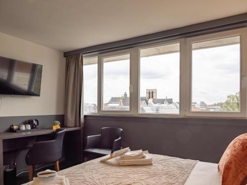 Foto de una habitación de Hotel Gravensteen