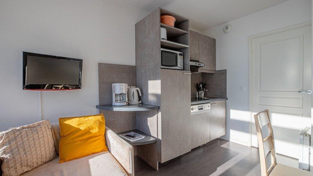 Foto de una habitación de Aparthotel Madame Vacances Les Terrasses De Véret