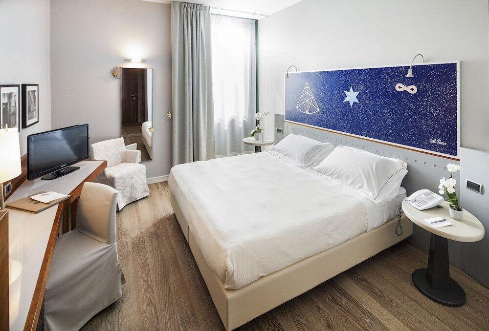 Foto de una habitación de Cosmo Hotel Torri