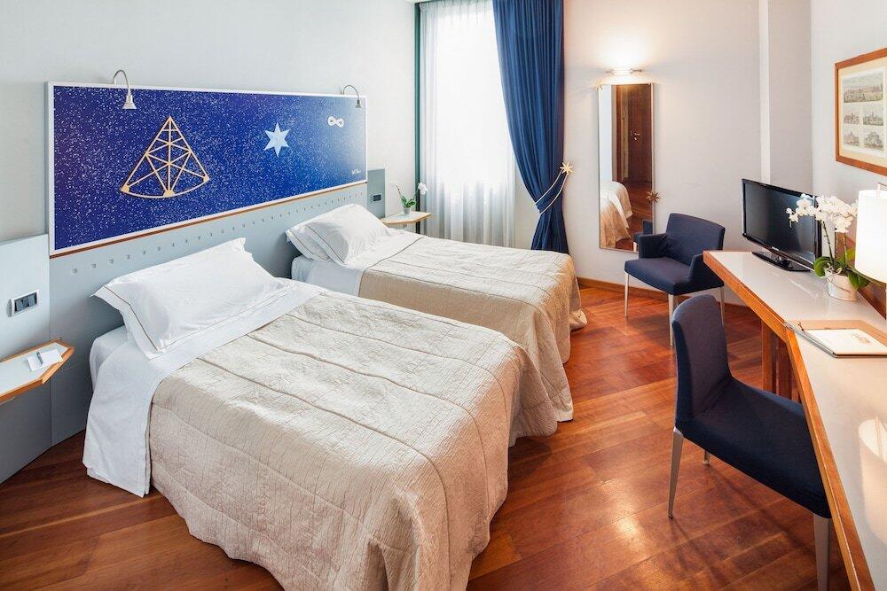 Foto de una habitación de Cosmo Hotel Torri
