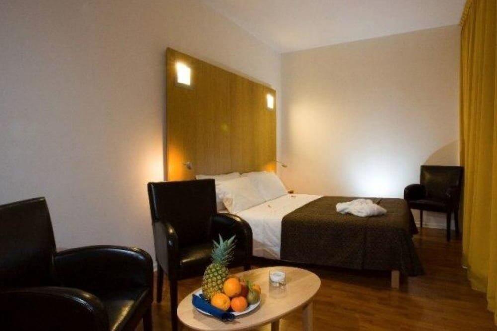 Foto de una habitación de Executive Hotel