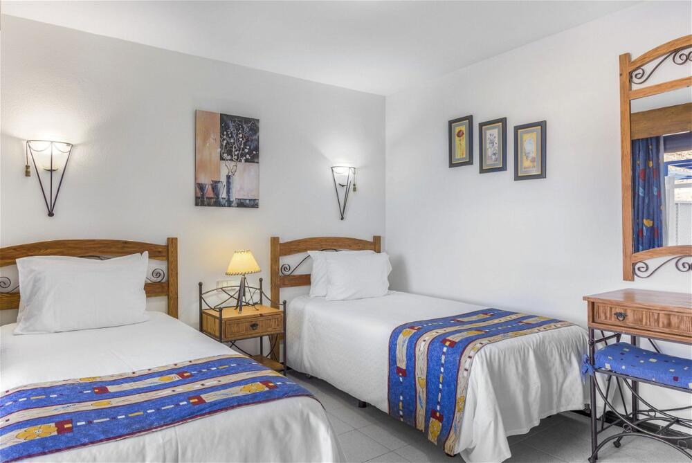 Foto de una habitación de Aparthotel Club Cala Blanca