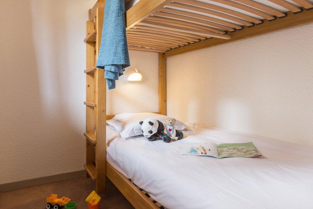 Foto de una habitación de Aparthotel Pierre &amp;amp; Vacances Residence Les Sentiers du Tueda