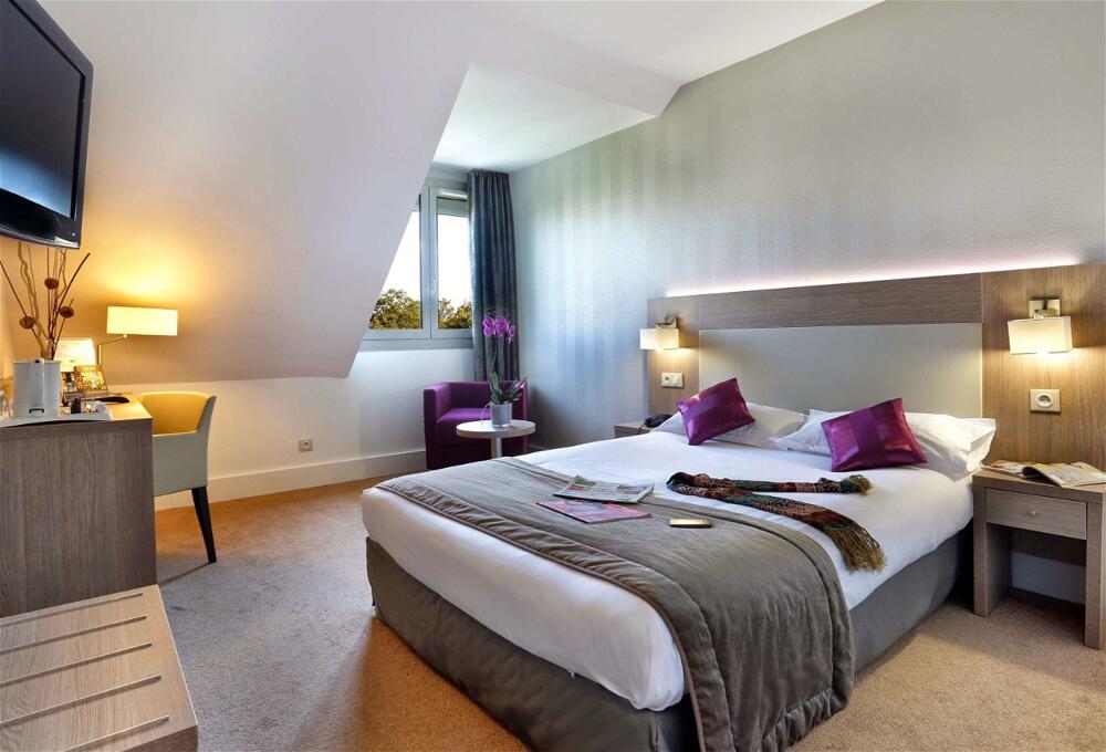 Foto de una habitación de Best Western Plus Hotel Du Parc Chantilly