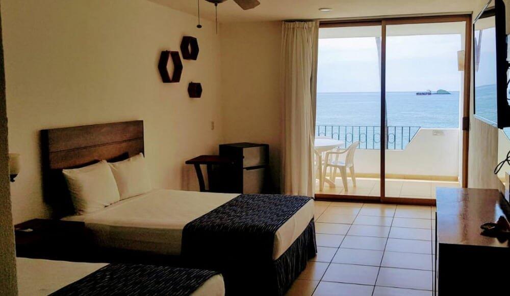 Foto de una habitación de Costa Alegre Hotel &amp;amp; Suites