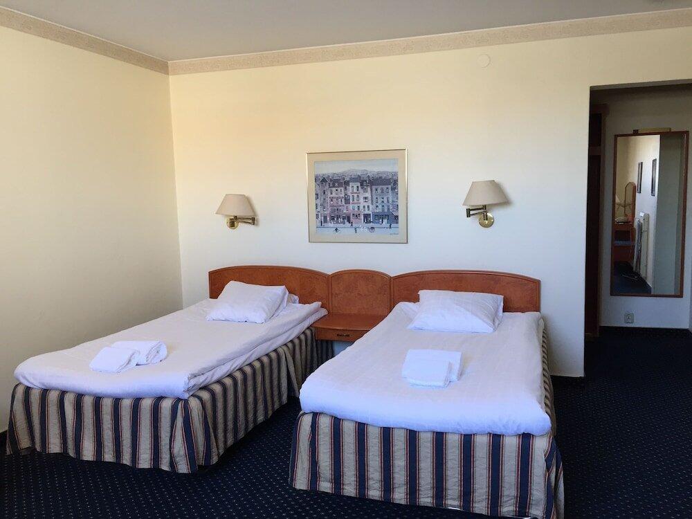 Foto de una habitación de First Hotel Statt