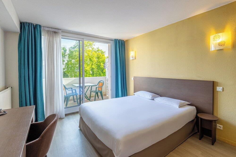 Foto de una habitación de Aparthotel Les Loges du Park