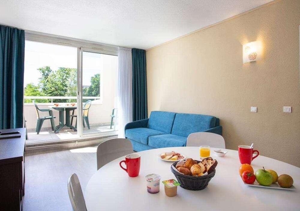 Foto de una habitación de Aparthotel Les Loges du Park