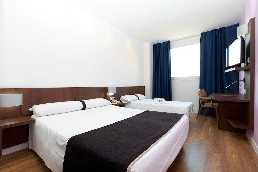 Foto de una habitación de Hotel Olympia Universidades