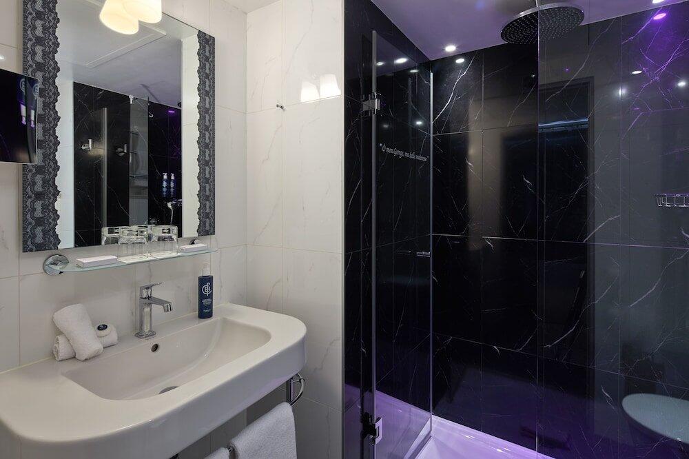 Foto del baño de Les Plumes Hotel