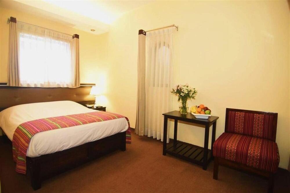Foto de una habitación de Tampu Hotel