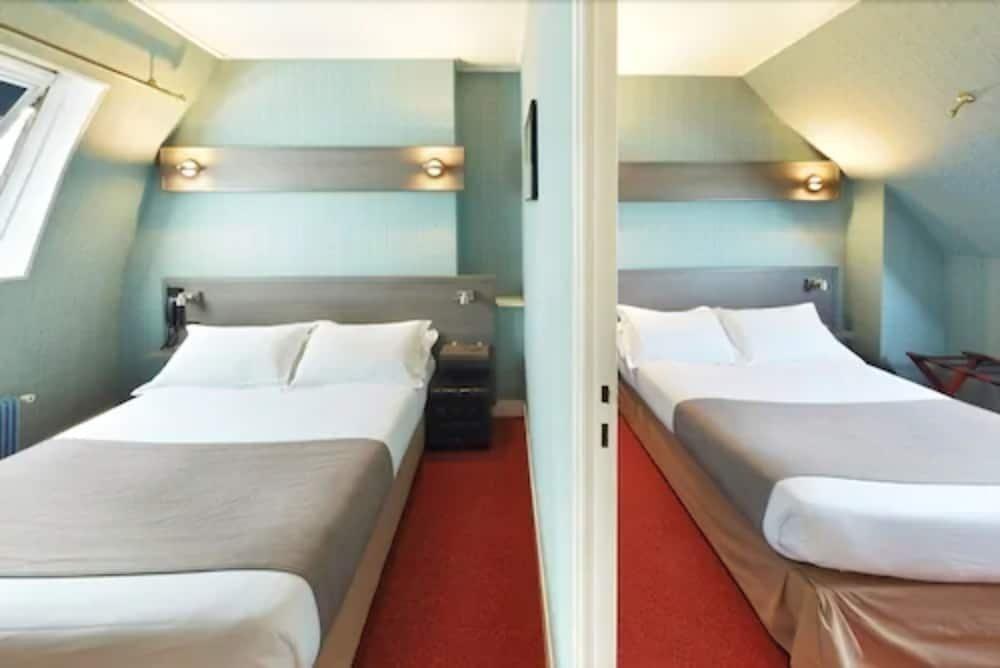 Foto de una habitación de Hotel Home Latin