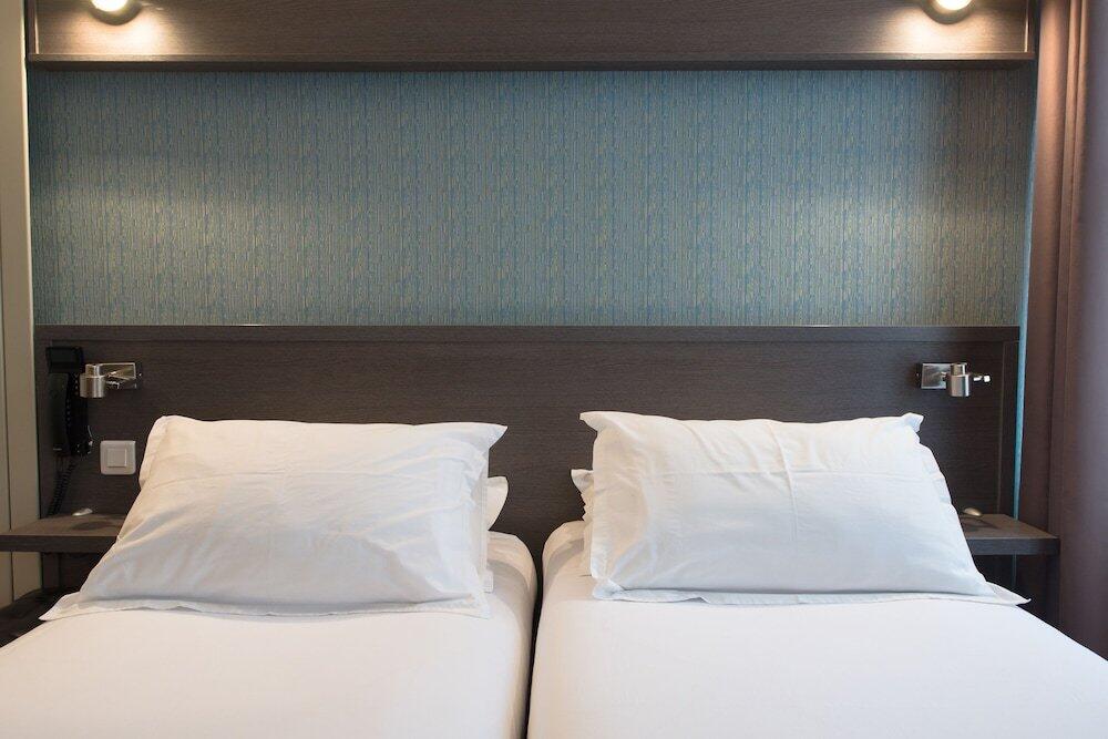 Foto de una habitación de Hotel Home Latin