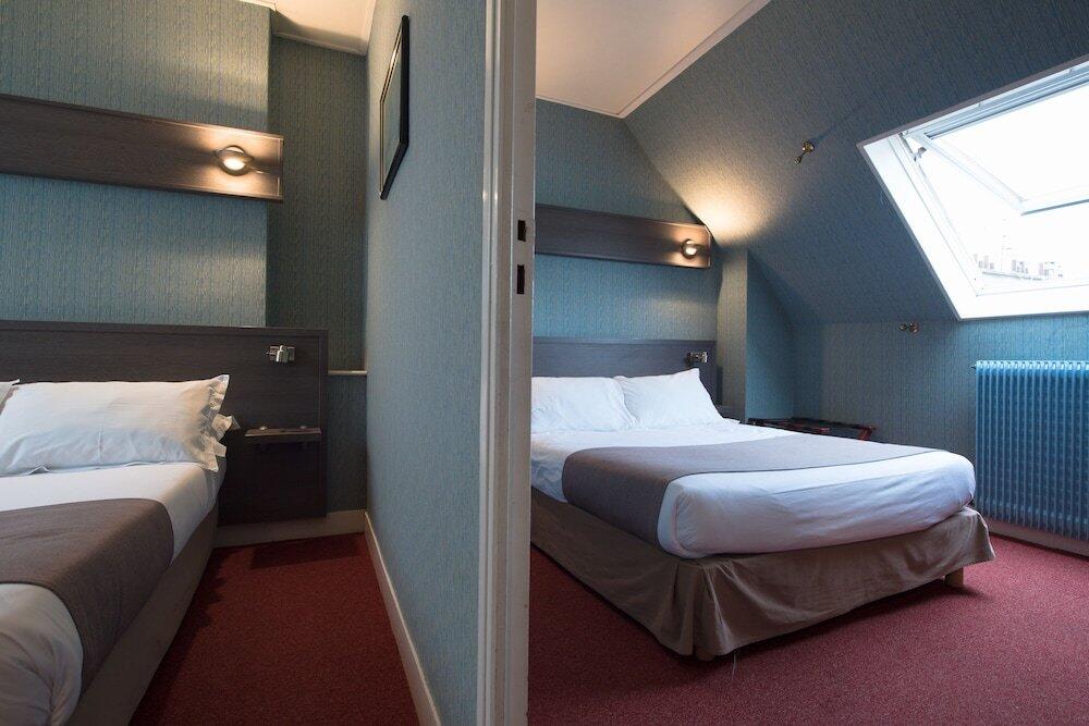 Foto de una habitación de Hotel Home Latin