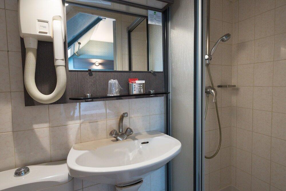 Foto del baño de Hotel Home Latin