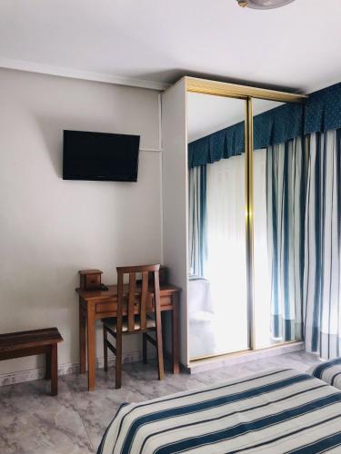 Foto de una habitación de Hotel Arillo