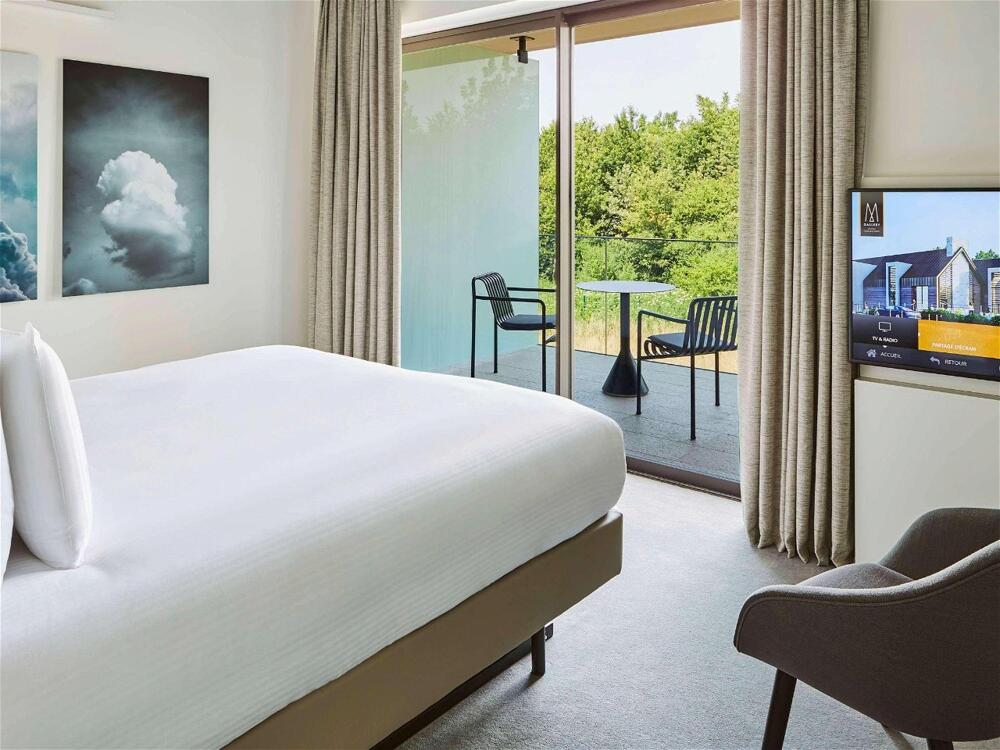Foto de una habitación de Hotel Le Domaine des Vanneaux Golf et Spa Mgallery