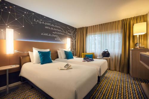 Foto de una habitación de Hotel Mercure Paris Sud Les Ulis