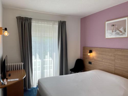 Foto de una habitación de Hotel Le Progres