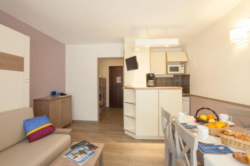 Foto de una habitación de Résidence Pierre &amp;amp; Vacances Les Platanes