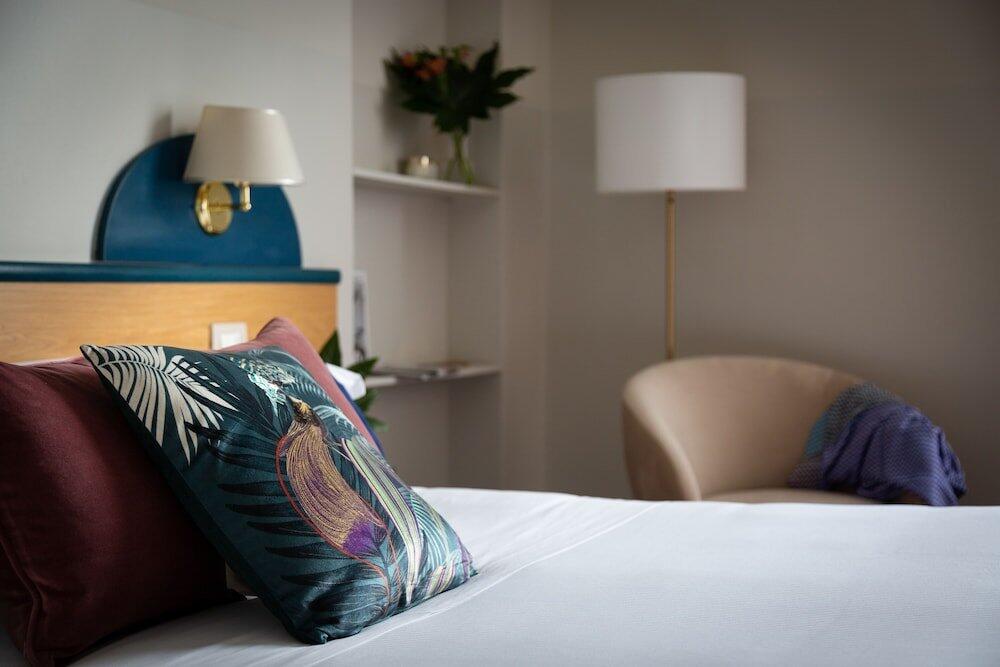 Foto de una habitación de Aramis Rooms