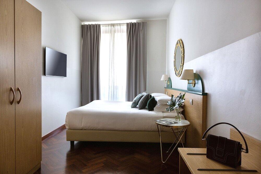 Foto de una habitación de Aramis Rooms