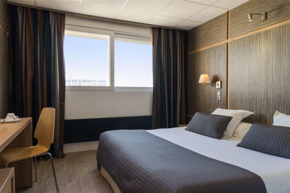 Foto de una habitación de The Originals Boutique, Hôtel Neptune, Montpellier Sud (Inter-Hotel)
